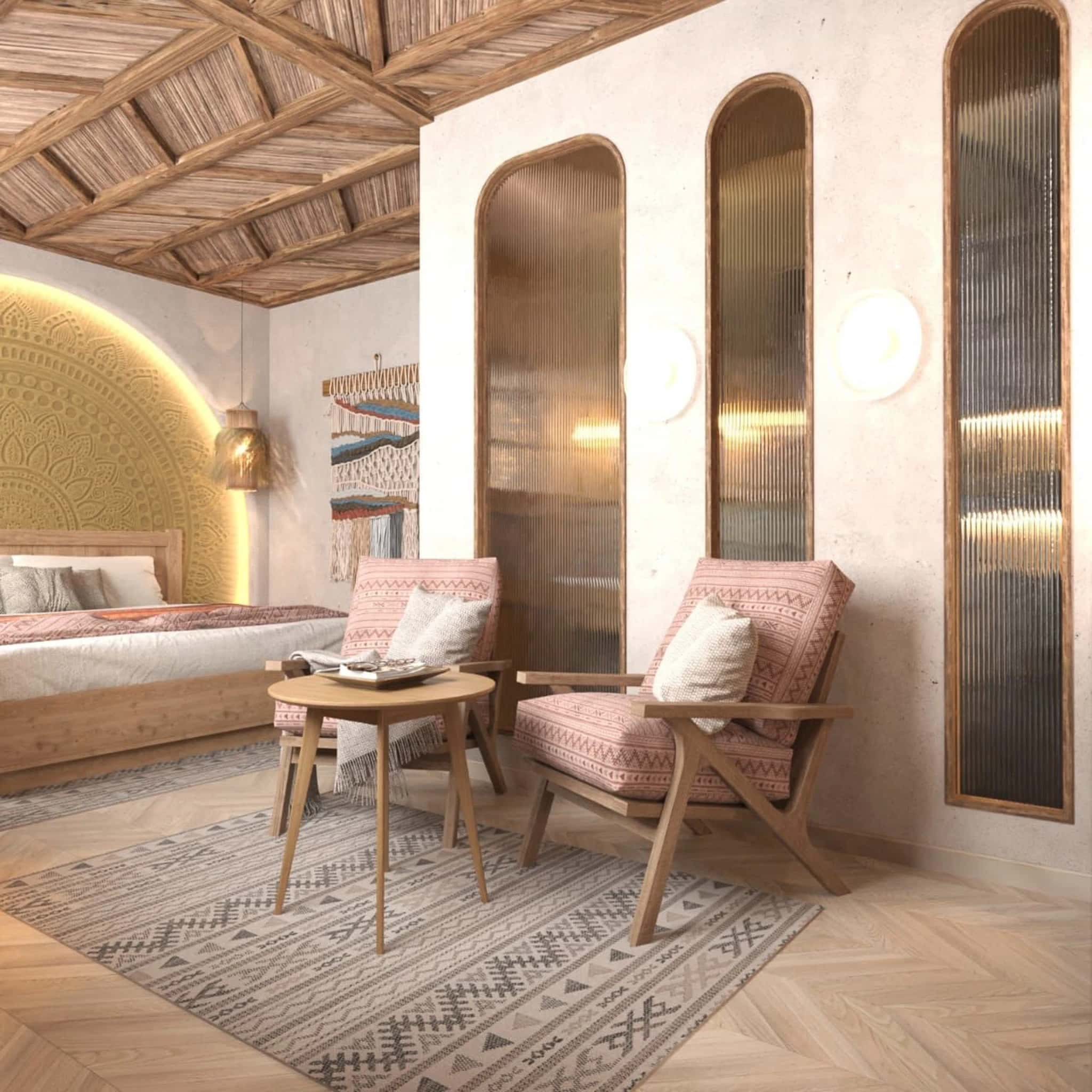 Detalle habitación doble Nonia & Nofret Habitación doble en la dahabeya Nonia & Nofret, con cama y sillones de madera, tejidos étnicos y decoración en tonos neutros.